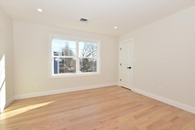 spare room featuring light hardwood / wood-style flooring