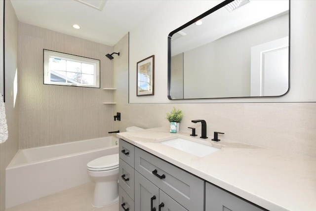 full bathroom with tiled shower / bath, vanity, and toilet