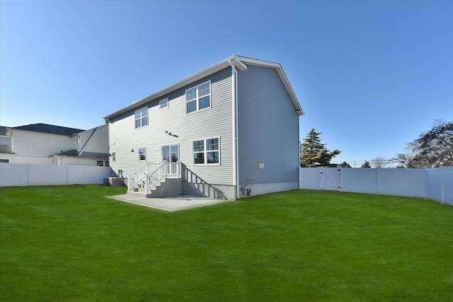 back of house with cooling unit, a lawn, and a patio