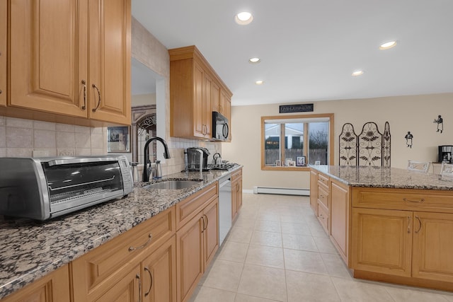 kitchen with sink, dishwasher, light stone countertops, light tile patterned flooring, and a baseboard radiator