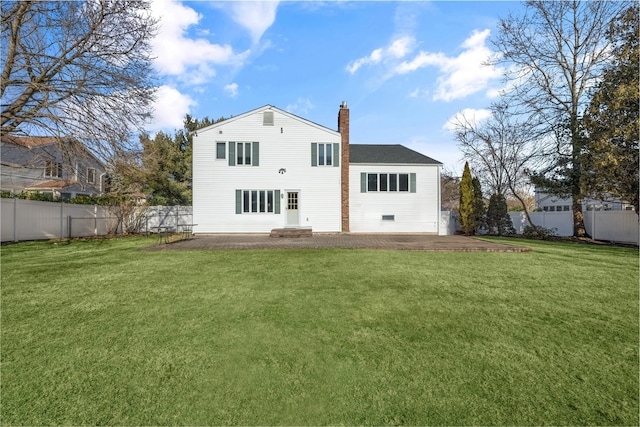 back of property featuring a patio area and a lawn