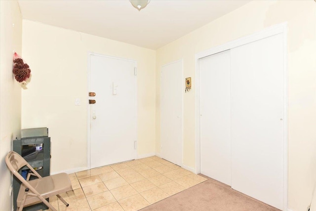 entrance foyer with light carpet