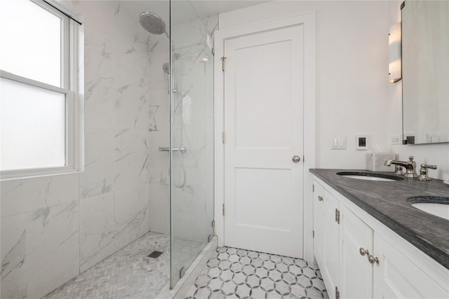 bathroom featuring vanity and a tile shower