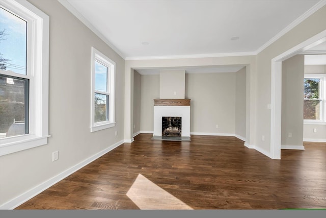 unfurnished living room featuring ornamental molding and dark hardwood / wood-style flooring