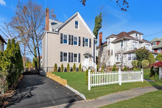 view of front of home with a front yard