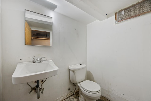 bathroom with sink and toilet