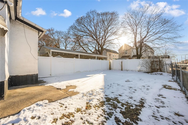 view of yard layered in snow