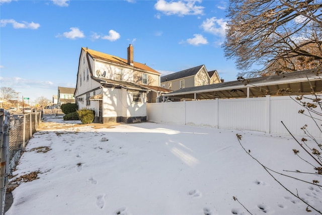 view of snow covered house