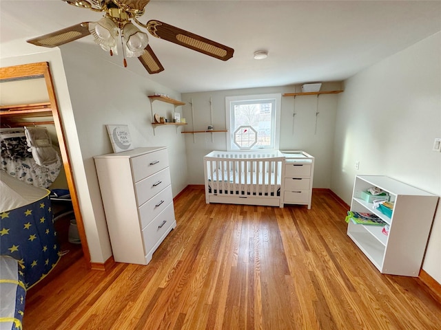 unfurnished bedroom with light hardwood / wood-style flooring and ceiling fan