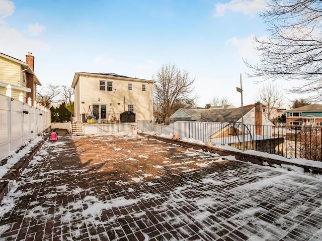 view of snow covered property