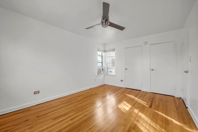 unfurnished bedroom with wood-type flooring and ceiling fan