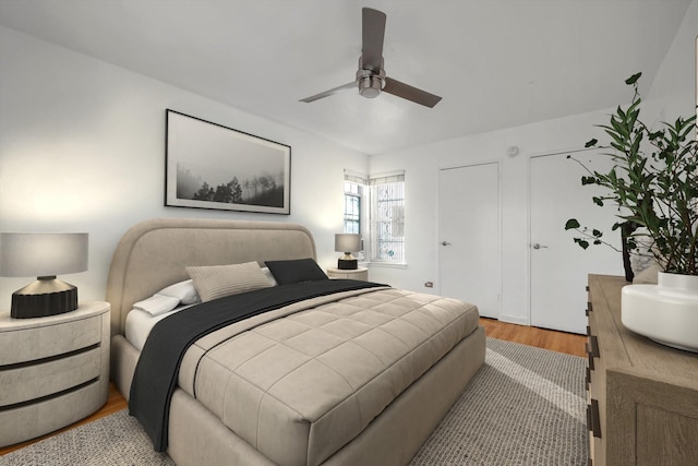 bedroom with ceiling fan and light hardwood / wood-style flooring