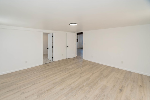 empty room with light hardwood / wood-style floors