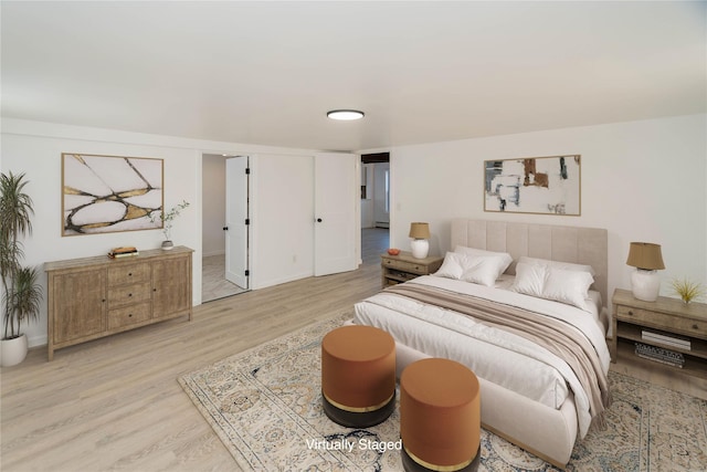 bedroom with light hardwood / wood-style flooring