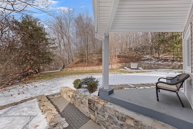 view of snow covered patio