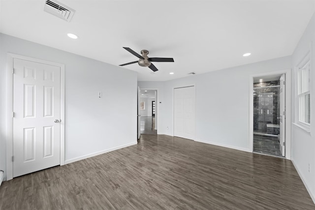 unfurnished room featuring ceiling fan and dark hardwood / wood-style flooring