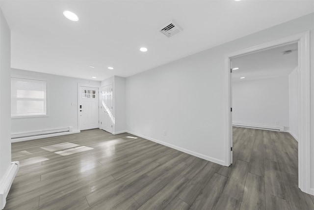 interior space with dark hardwood / wood-style flooring and a baseboard radiator