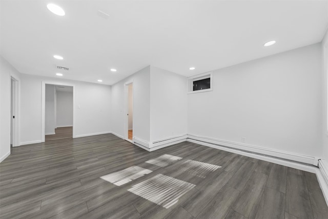 basement featuring dark hardwood / wood-style floors