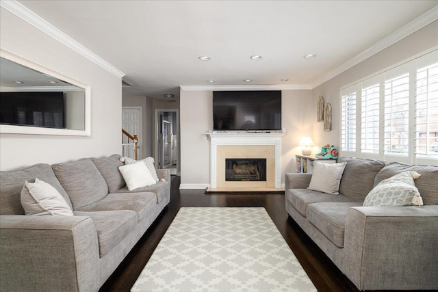 living room featuring ornamental molding and dark hardwood / wood-style floors