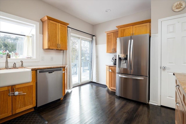 kitchen with dark hardwood / wood-style flooring, sink, and appliances with stainless steel finishes