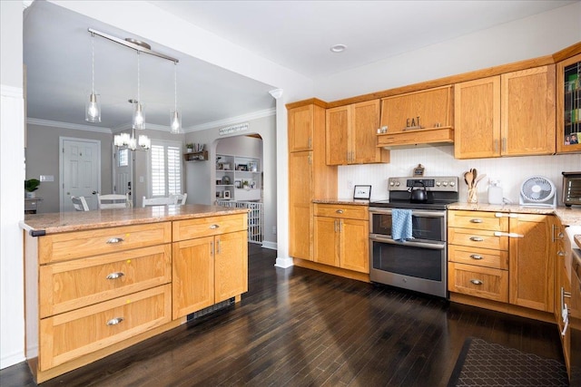 kitchen with tasteful backsplash, range with two ovens, hanging light fixtures, ornamental molding, and dark wood-type flooring