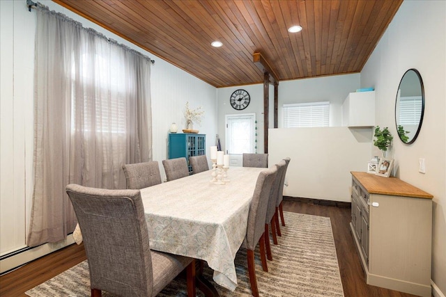 dining room with dark hardwood / wood-style flooring, wood ceiling, a baseboard radiator, and crown molding