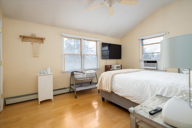 bedroom with multiple windows, lofted ceiling, cooling unit, and light hardwood / wood-style floors