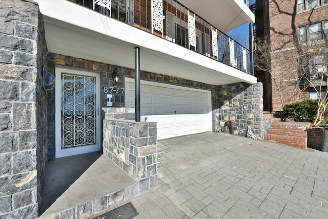 doorway to property featuring a garage