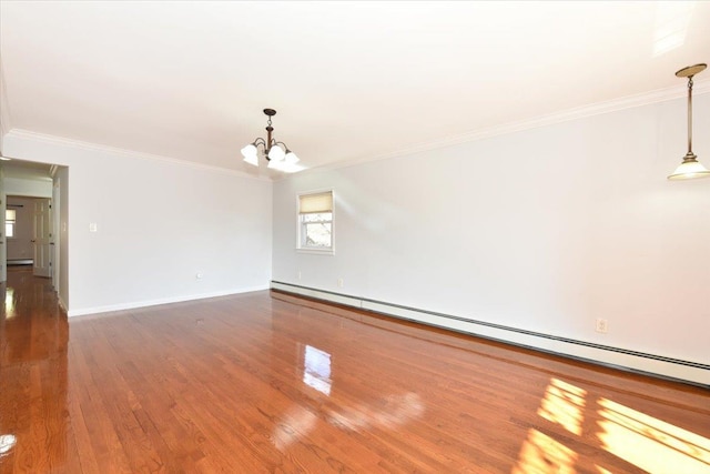 empty room featuring wood-type flooring, a baseboard heating unit, an inviting chandelier, and ornamental molding