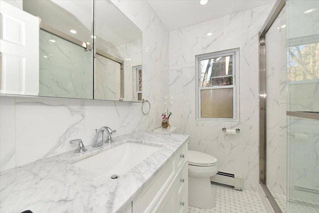 bathroom featuring a baseboard radiator, plenty of natural light, tile walls, and vanity