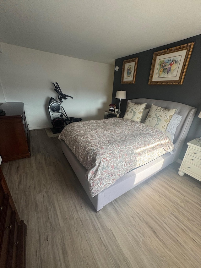 bedroom featuring hardwood / wood-style floors