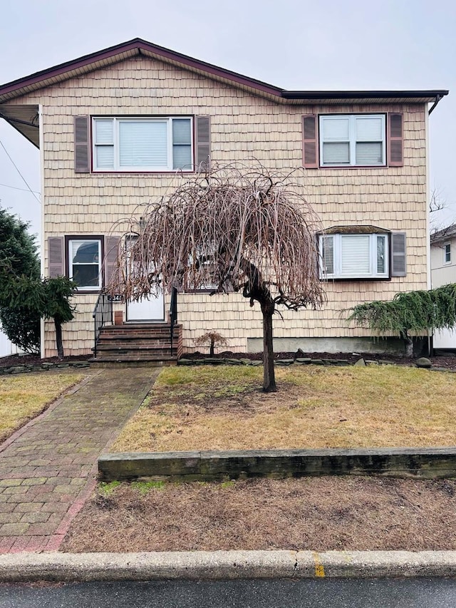 view of front property with a front lawn