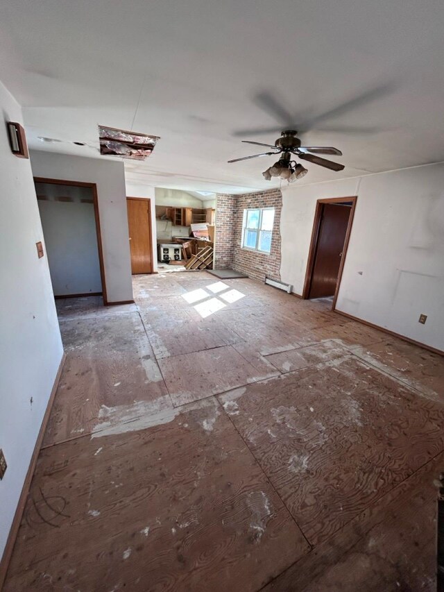 unfurnished living room featuring ceiling fan