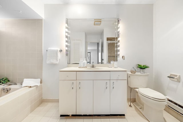 bathroom with tile patterned flooring, a baseboard heating unit, vanity, a relaxing tiled tub, and toilet