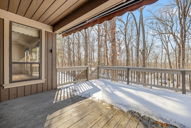 view of snow covered deck