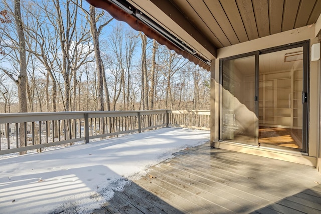 view of snow covered deck