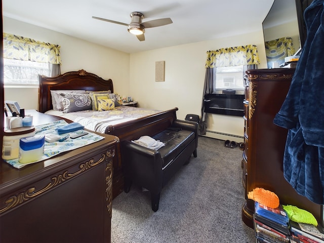 carpeted bedroom featuring baseboard heating, ceiling fan, and multiple windows