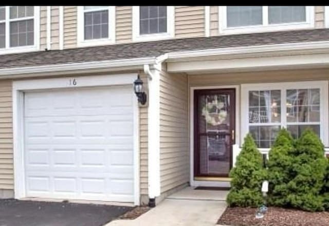 property entrance featuring a garage