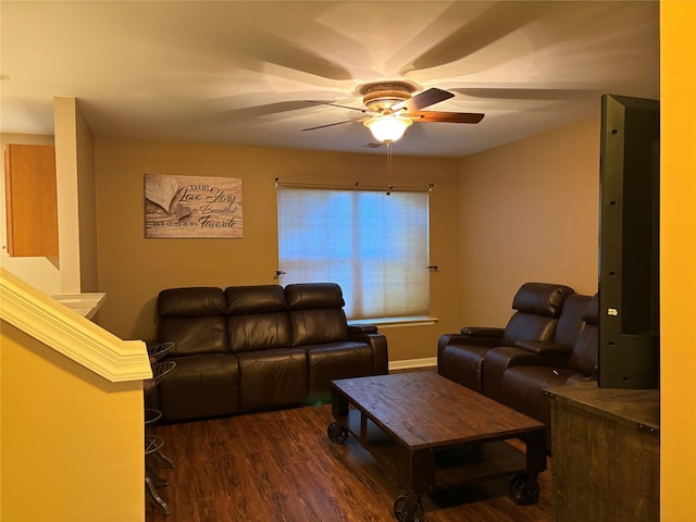 living room with ceiling fan and dark hardwood / wood-style flooring