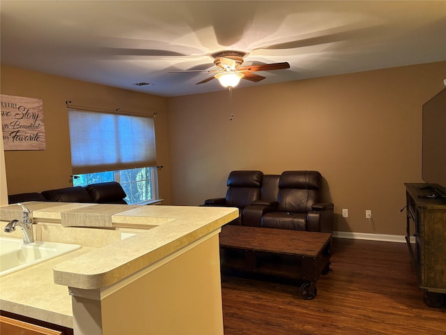 living room featuring dark hardwood / wood-style floors and ceiling fan