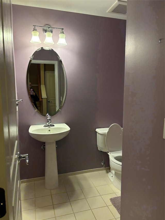 bathroom with tile patterned floors and toilet