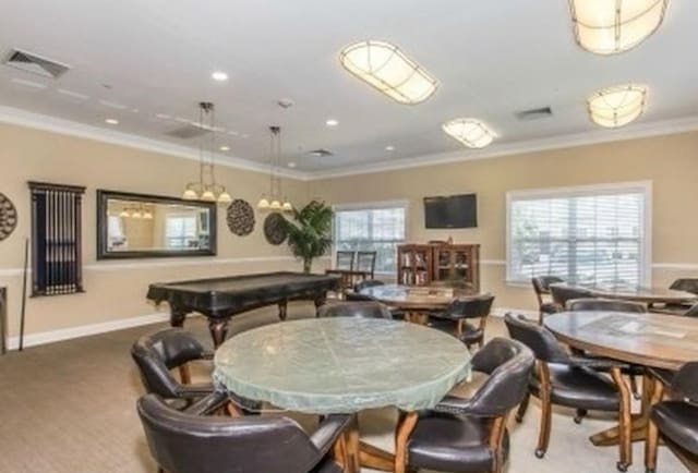 dining area with crown molding