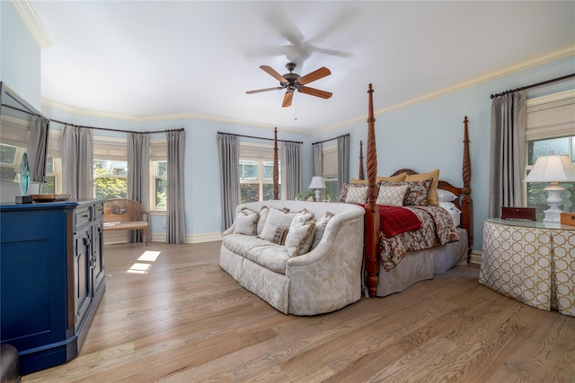 bedroom with ceiling fan, ornamental molding, and light hardwood / wood-style floors