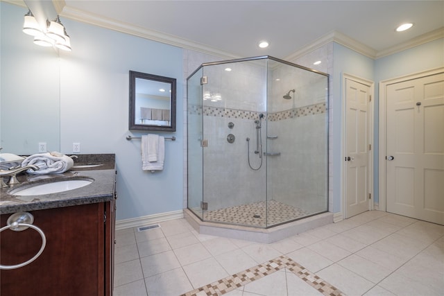 bathroom with crown molding, vanity, an enclosed shower, and tile patterned flooring