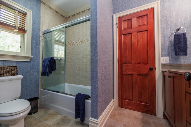 full bathroom with ornamental molding, vanity, toilet, and combined bath / shower with glass door