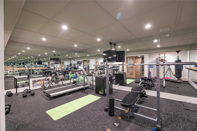 exercise room with a drop ceiling