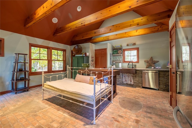 bedroom with lofted ceiling with beams and sink