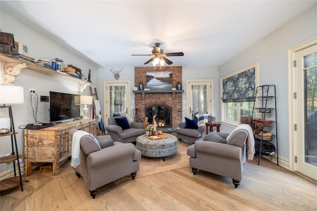 1750 Laurel Lake Dr, Mattituck, NY 11952 - living room featuring light wood-style floors, ceiling fan, and plenty of natural light