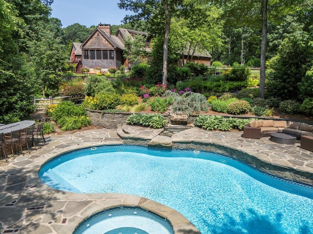 1750 Laurel Lake Dr, Mattituck, NY 11952 - swimming pool featuring a patio, an outdoor hangout area, and an in-ground hot tub