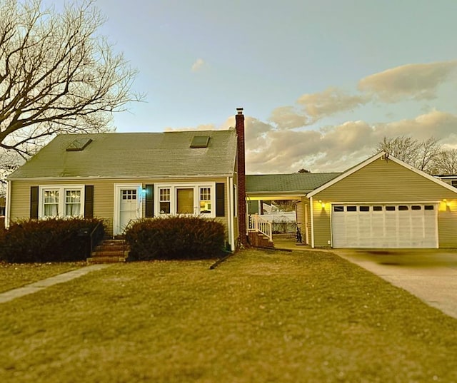 view of front of property featuring a garage and a front lawn